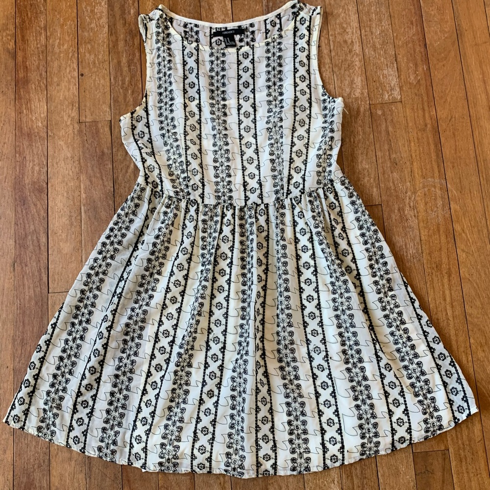 White fit n’ flare dress with black lace detailing